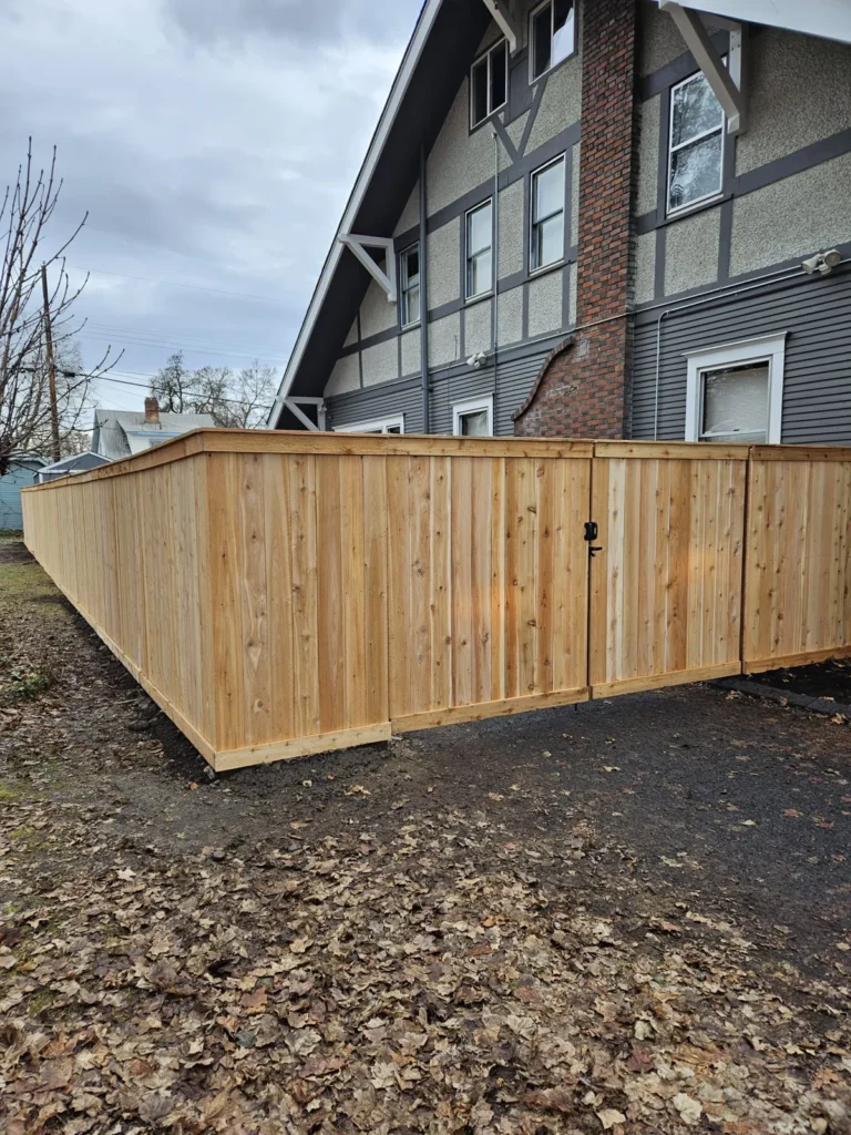 Wood enclosure beside townhomes