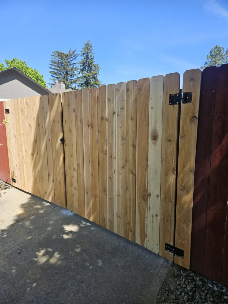 Wood gate & open rail fence