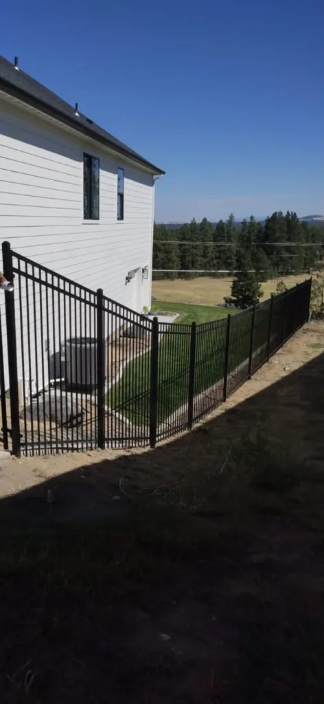 Sloped ornamental metal fence
